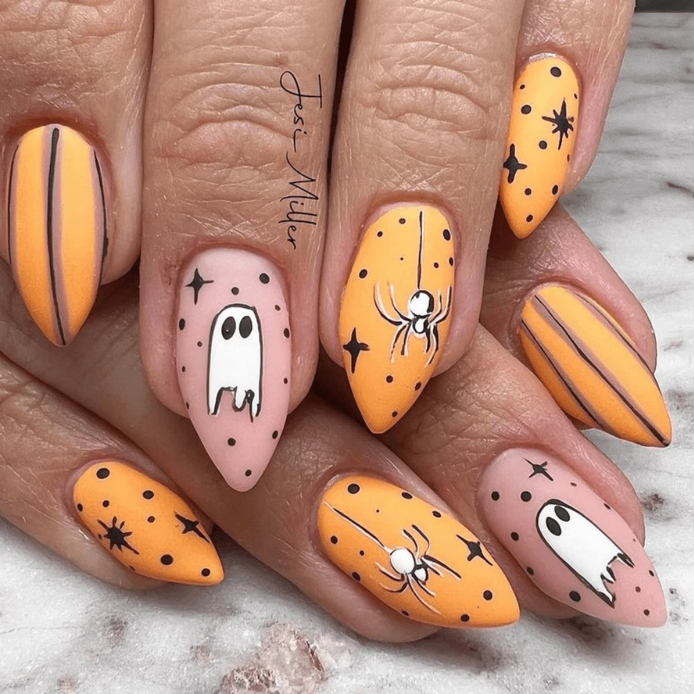 Orange spider white ghost and black outline star nail ghost nails design