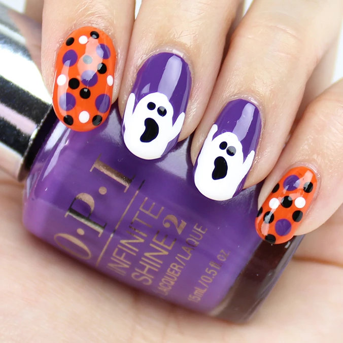 Stunning orange and purple Halloween Ghost nail art designs