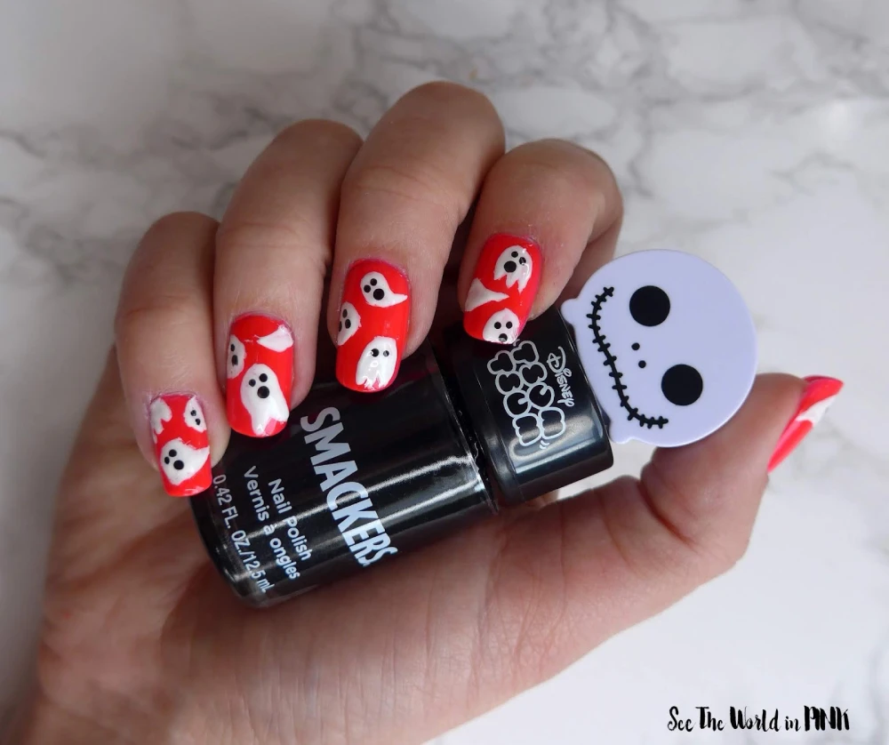 Red and white ghostly design nails