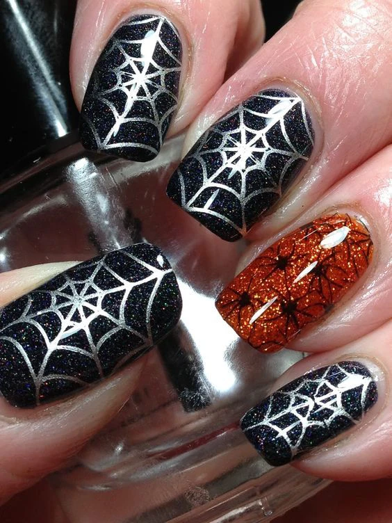 Short Black and Orange nails with spider web 