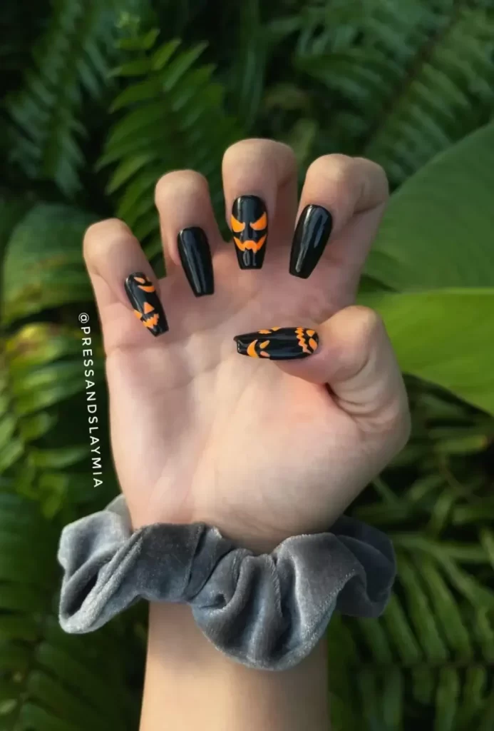 Face Design Acrylic Coffin Black and orange nails