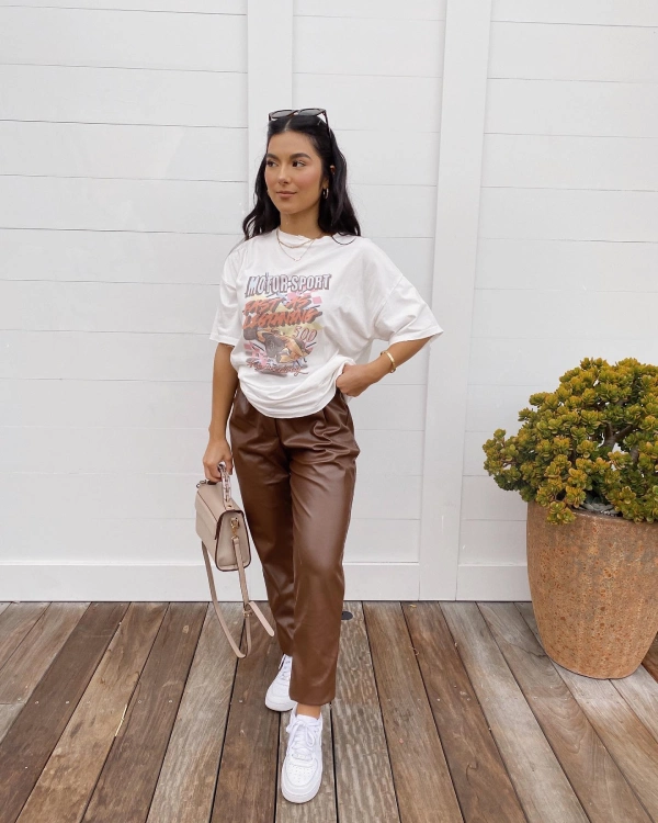 brown leather pants and graphic tee