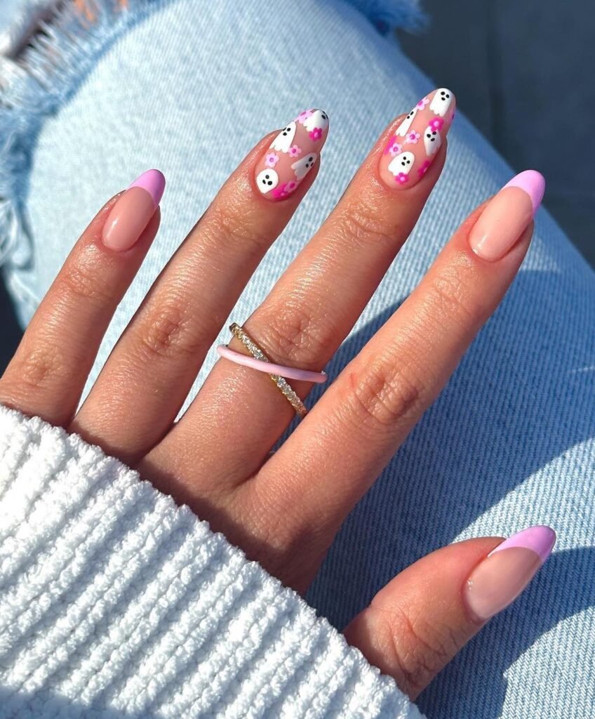 Pink french tip nail design with ghost