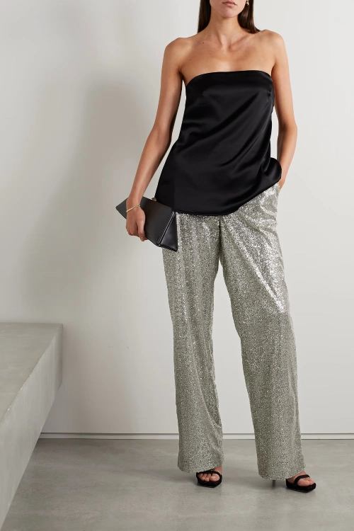black blouse and silver glitter pants