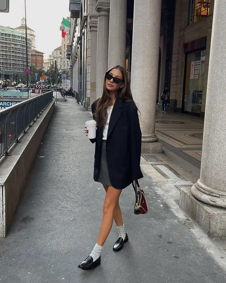 Grey mini skirt, black blazer and flats