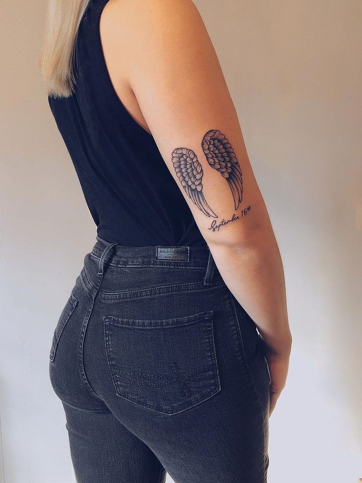 wing tattoo with date