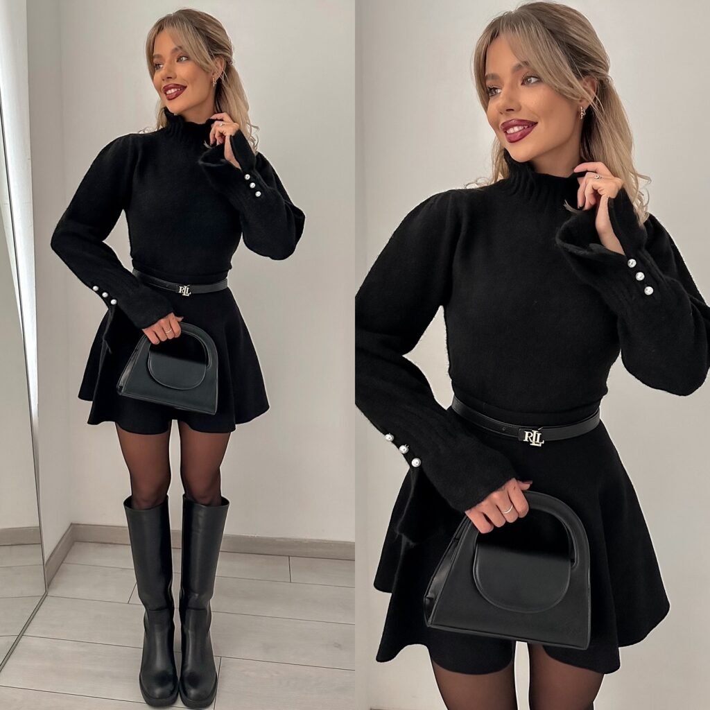 Woman in black sweater and pleated skirt and boots