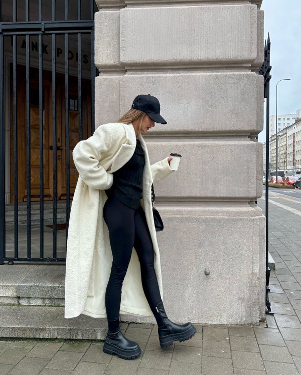 how to style black sweater with large white coat