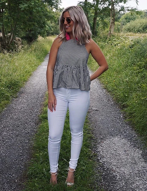 White jeans paired with a striped T-shirt