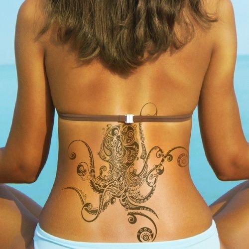 Large tattoo on the lower back