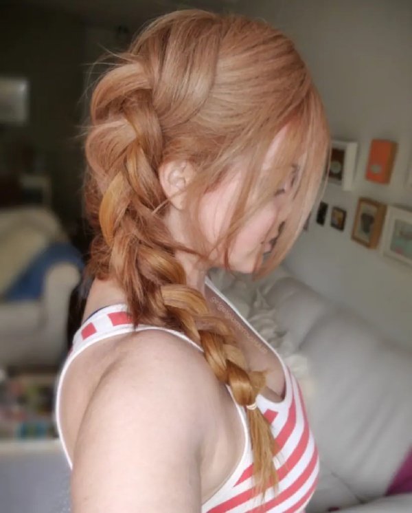 Loose French strawberry blonde Braid