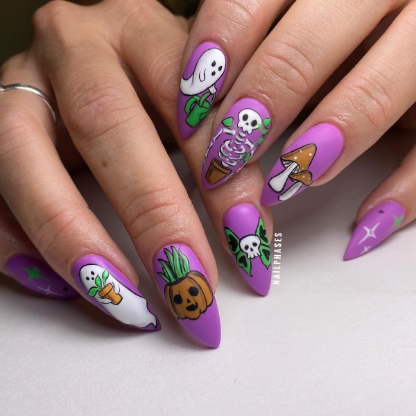 purple nails with pumpkin design