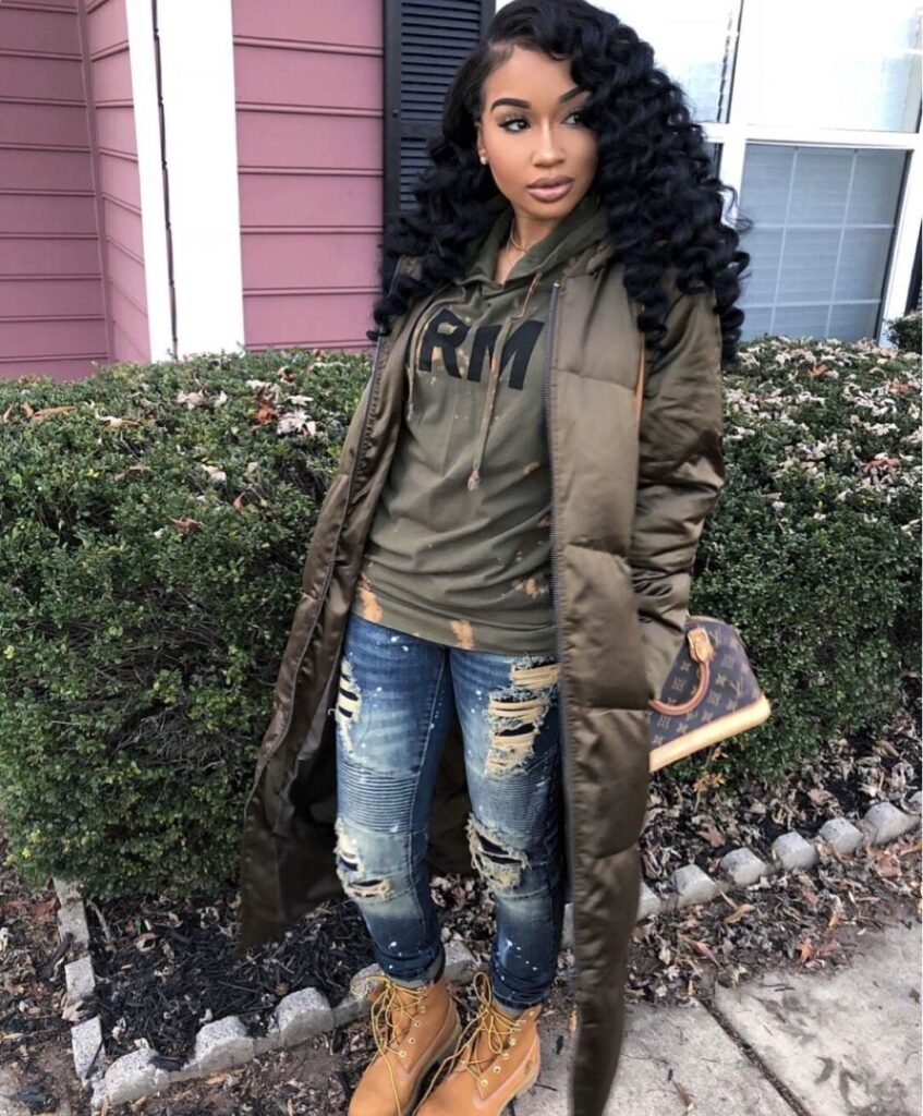 Long Brown Puffer Winter Coat with Timberland boots and LV Small bag Winter Jacket Outfits Black Women