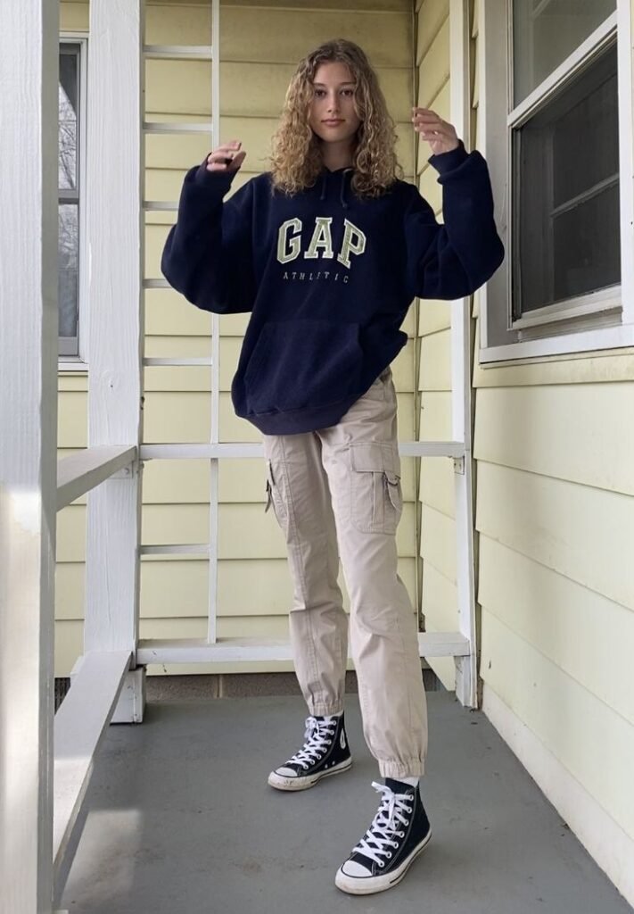 Comfortable look featuring an oversized hoodie, olive green cargo pants, and all stars shoes