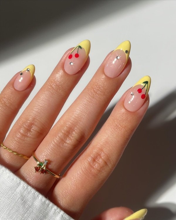 Yellow almond french tip cherry nail design