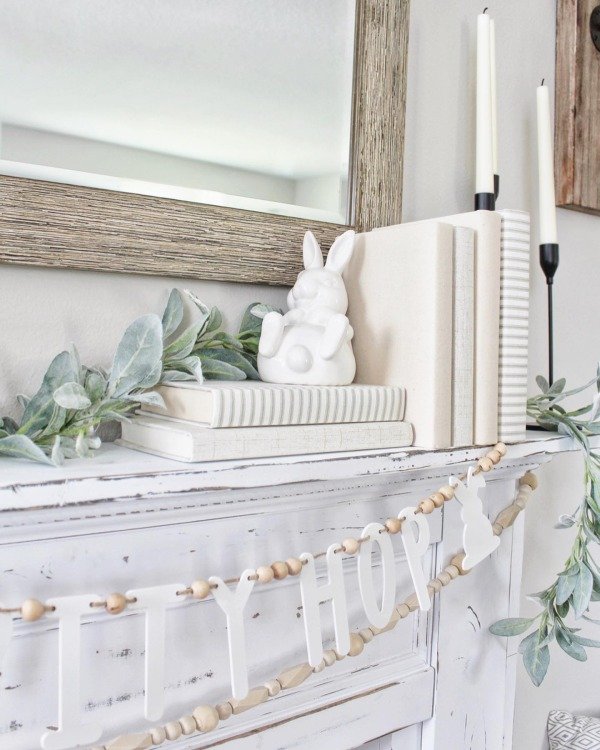 Bunny sitting on books on mantel