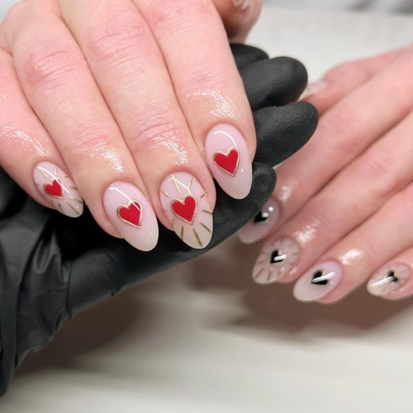 red and black hearts on shine finish nails