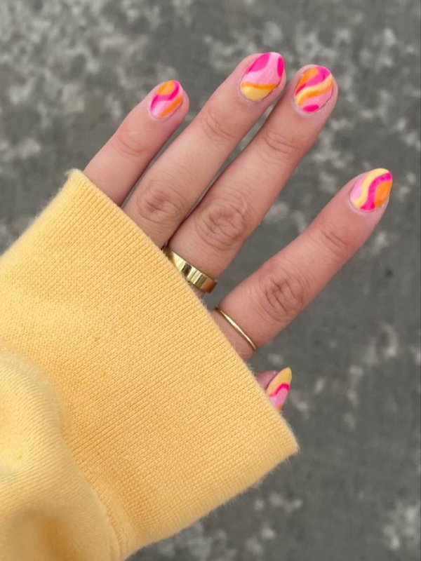 bright color manicure with groovy swerl design for spring