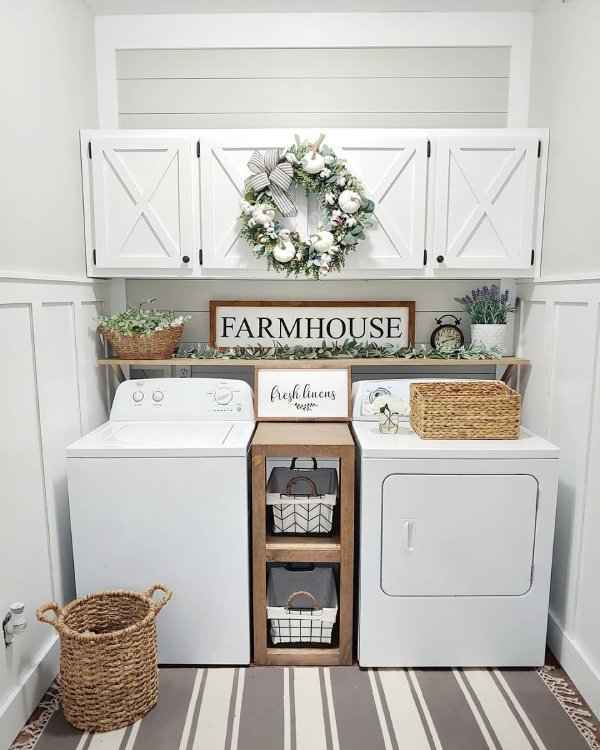 A small plant or faux greenery sits on a shelf near the machines. It brings life and a pop of green to the space.
