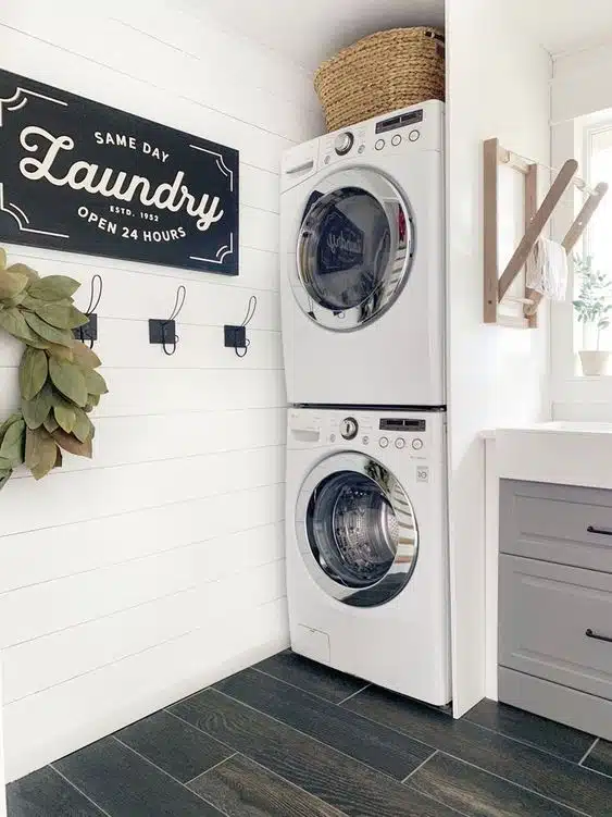 Hooks and a rail are installed for hanging damp clothes and freshly pressed items. They prevent wrinkles and save space.