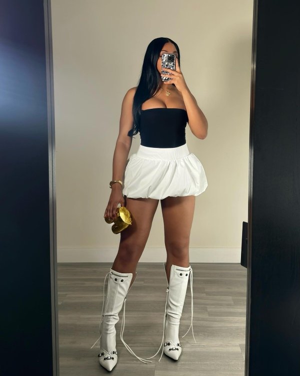 Balloon Skirt and Bandeau Top. Black tubetop amd white bubble skirt and white boots.