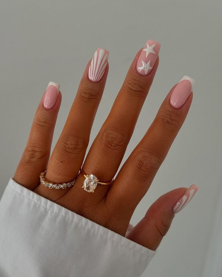 sea inspired nails with shell and french tip