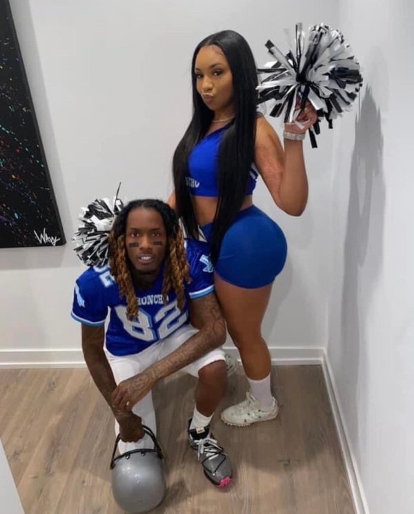 A classic Halloween costume idea with a Black couple dressed as a football player and cheerleader. Their look is flirty, energetic, and full of school spirit.