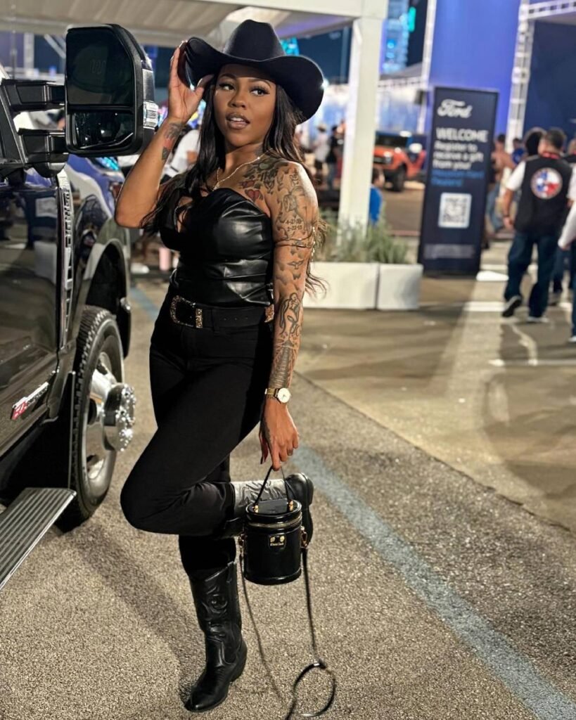 Cowboy outfit for a black woman  Modern style Black Pants, leather top, and big Buckled Belt