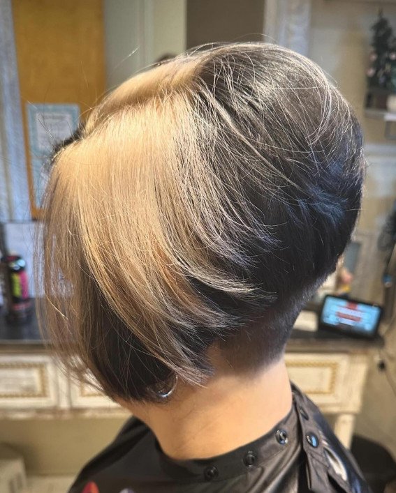 Layered short stack bob with side-swept bangs