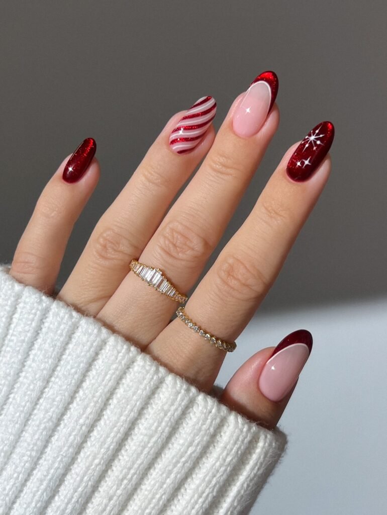 Glossy red nails with candy stripe, french tips and star. This nail design is elegant and cute.
