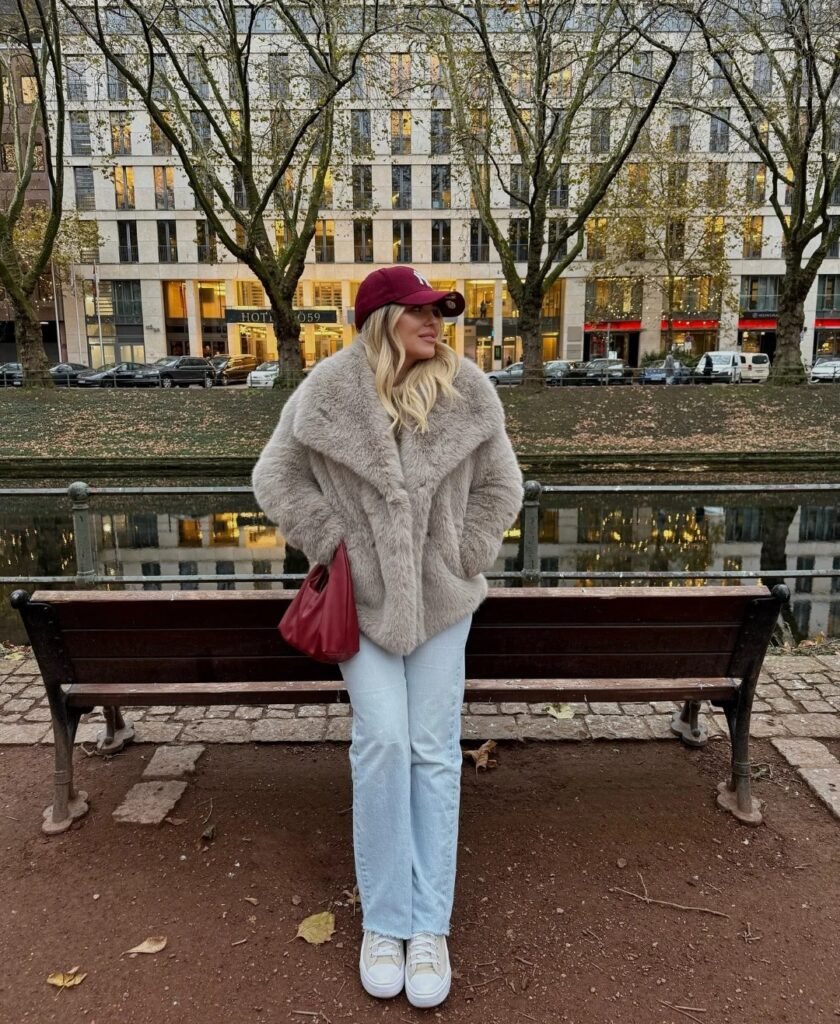 Winter outfit ideas for women over 50 Fur jacket with Jeans and sneakers