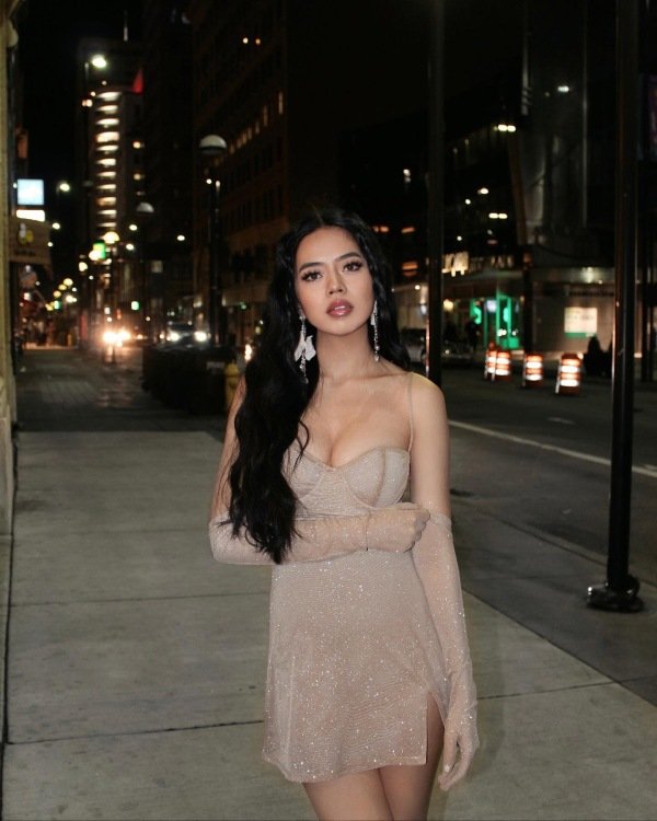 Elegant neutral dress styled with festive accessories for a dressy Mardi Gras outfit.