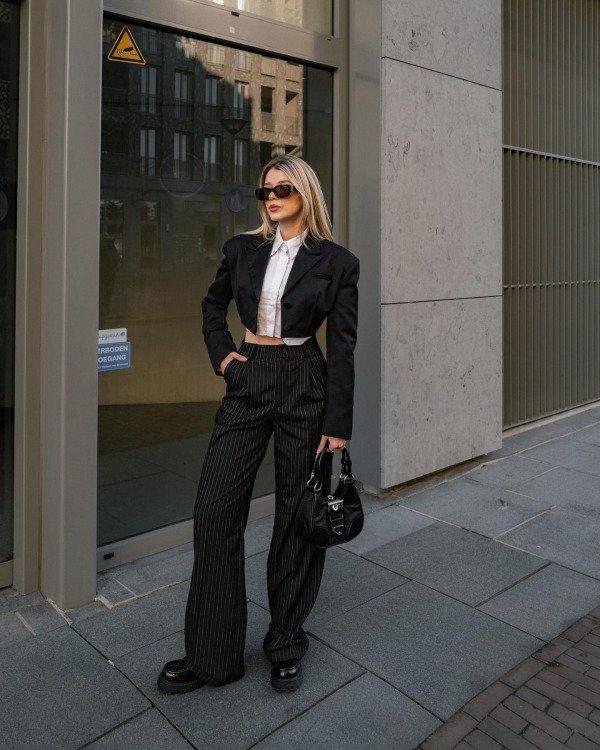 Black wide-leg pants with cropped blazer chic concert outfit idea for women over 40
