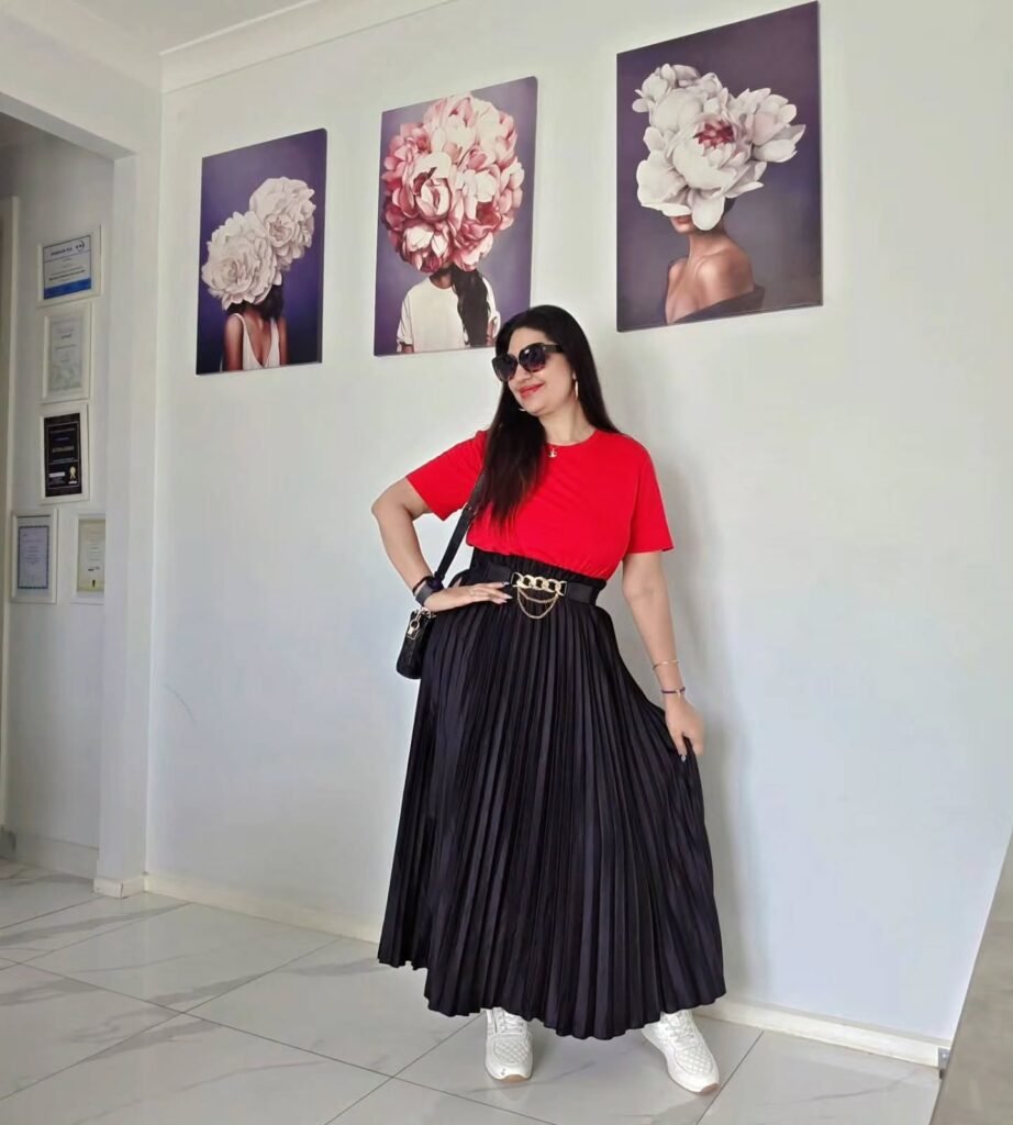Black midi skirt with fitted t-shirt and belt stylish concert outfit for women over 40