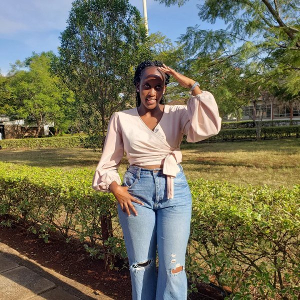 High-waisted jeans with wrap top flattering concert outfit for women over 40