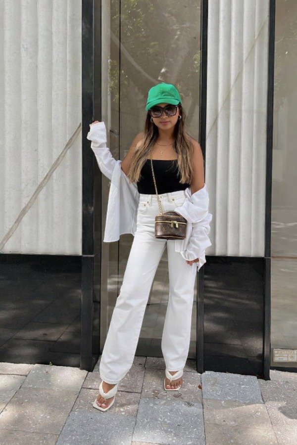 White straight-leg jeans with black tank top stylish summer concert outfit for women over 40