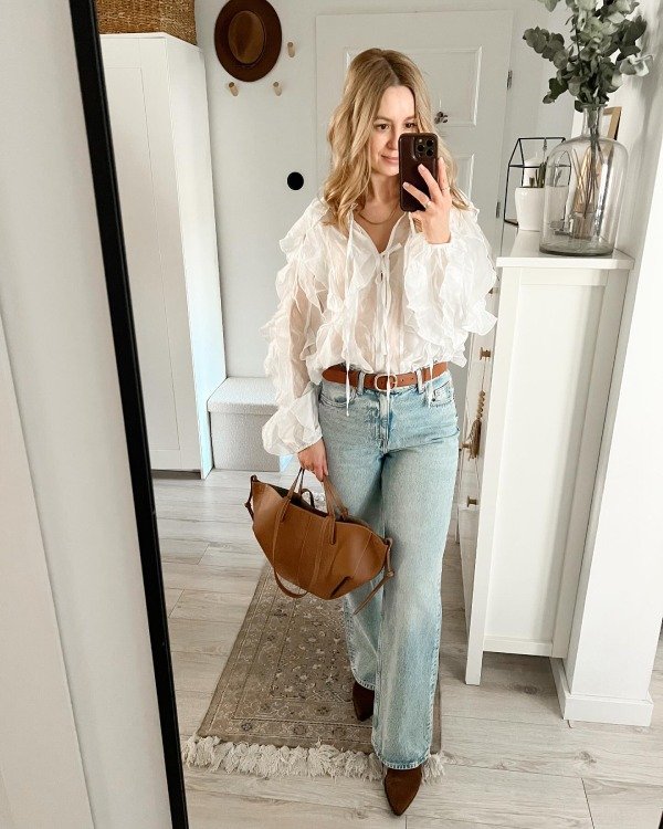 Bootcut jeans with flowy boho blouse country concert outfit for women over 40
