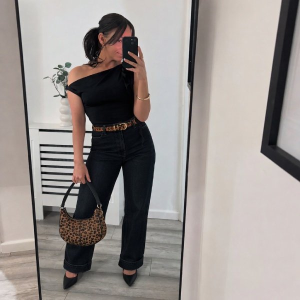 Dark denim jeans with off-shoulder top feminine concert outfit for women over 40