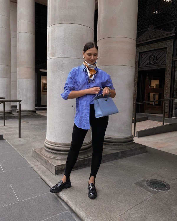 Loose button-down shirt worn over leggings and tank for a lightweight summer outfit