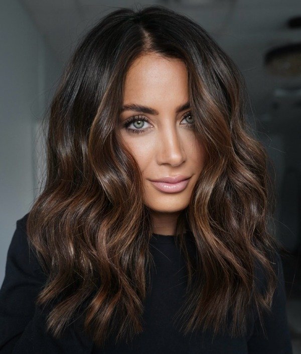 Dark chocolate brown hair with warm caramel highlights blending grey hair naturally