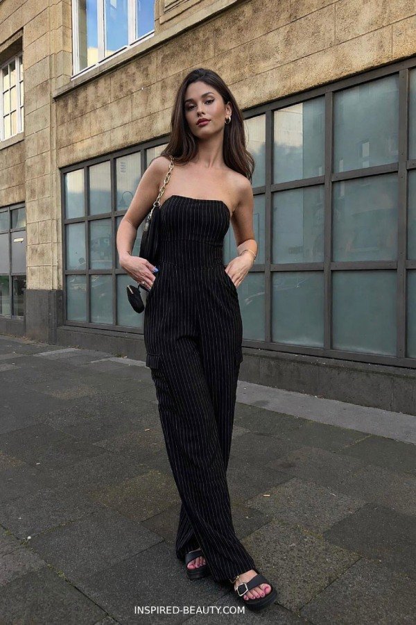 Sleeveless wide-leg jumpsuit styled with platform sandals for a modern summer party outfit