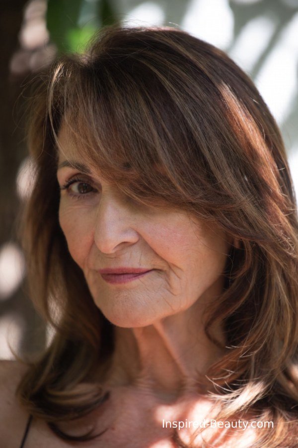 Mocha brown hair with soft highlights creating dimension to hide grey hair