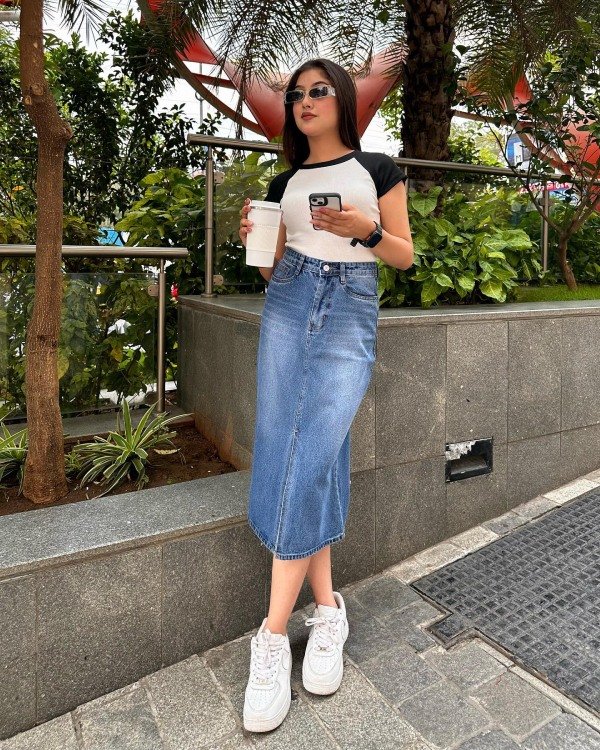 Casual denim skirt outfit paired with white sneakers for school