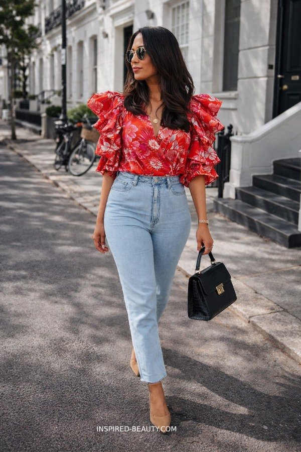Ruffle sleeve statement top paired with simple shorts for a trendy summer outfit