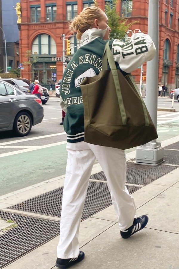 Varsity jacket outfit with sneakers for a sporty back-to-school aesthetic.